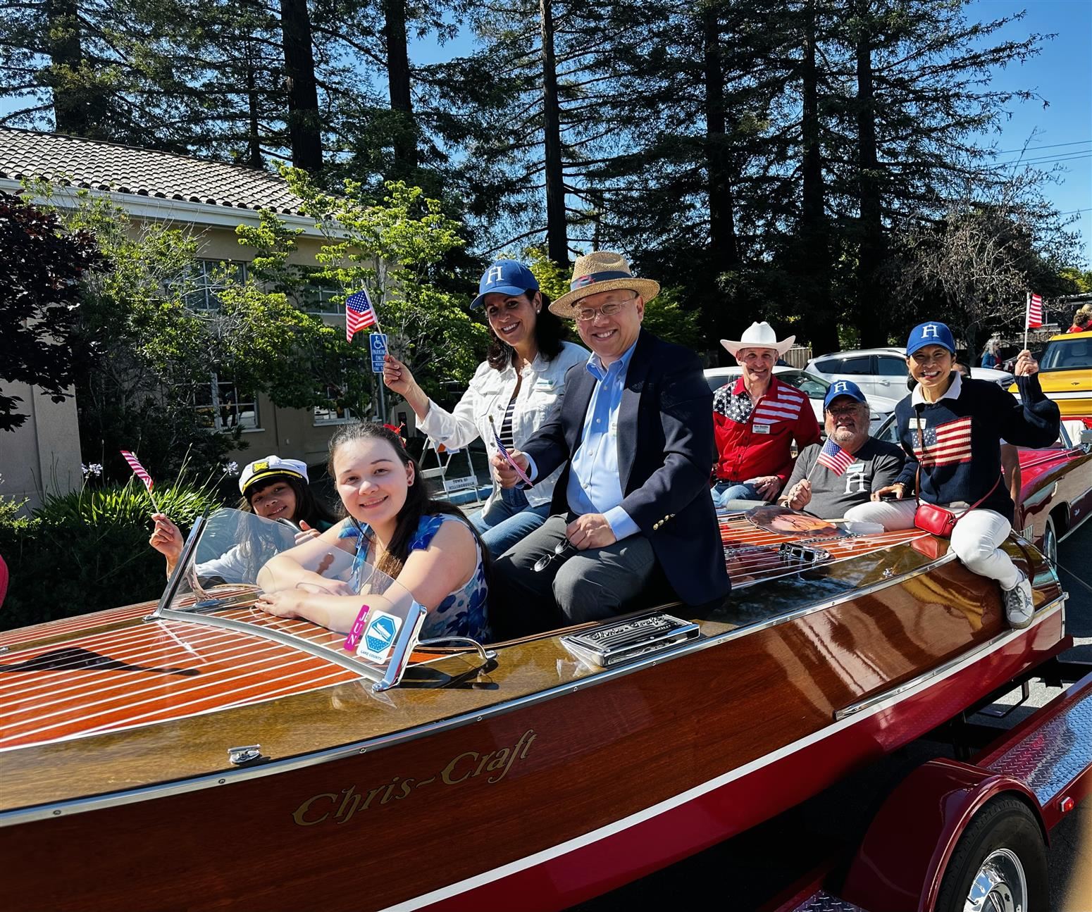 Trustees in boat at Memorial Day Parade